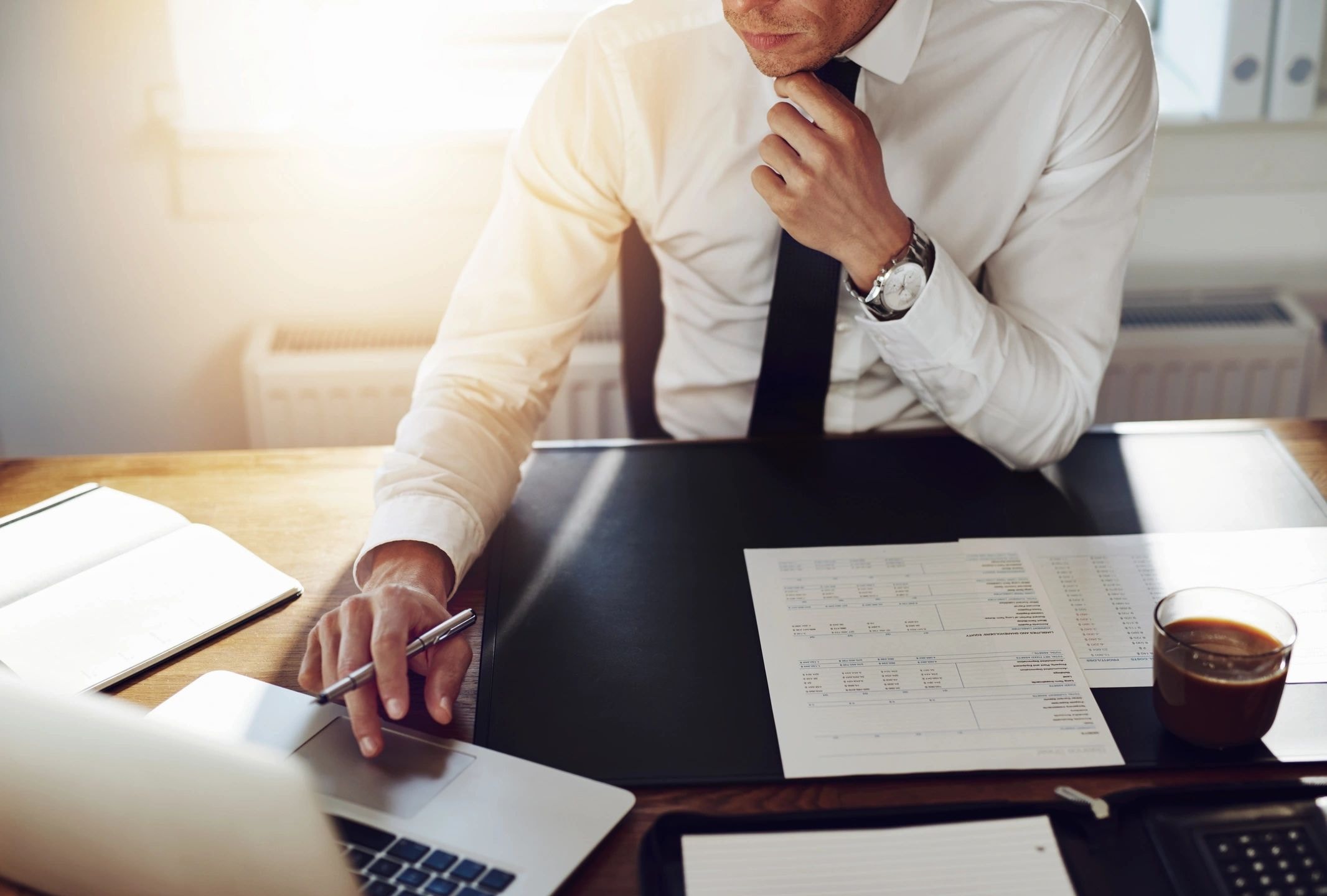 Professional reviewing insurance claim documents after a car accident